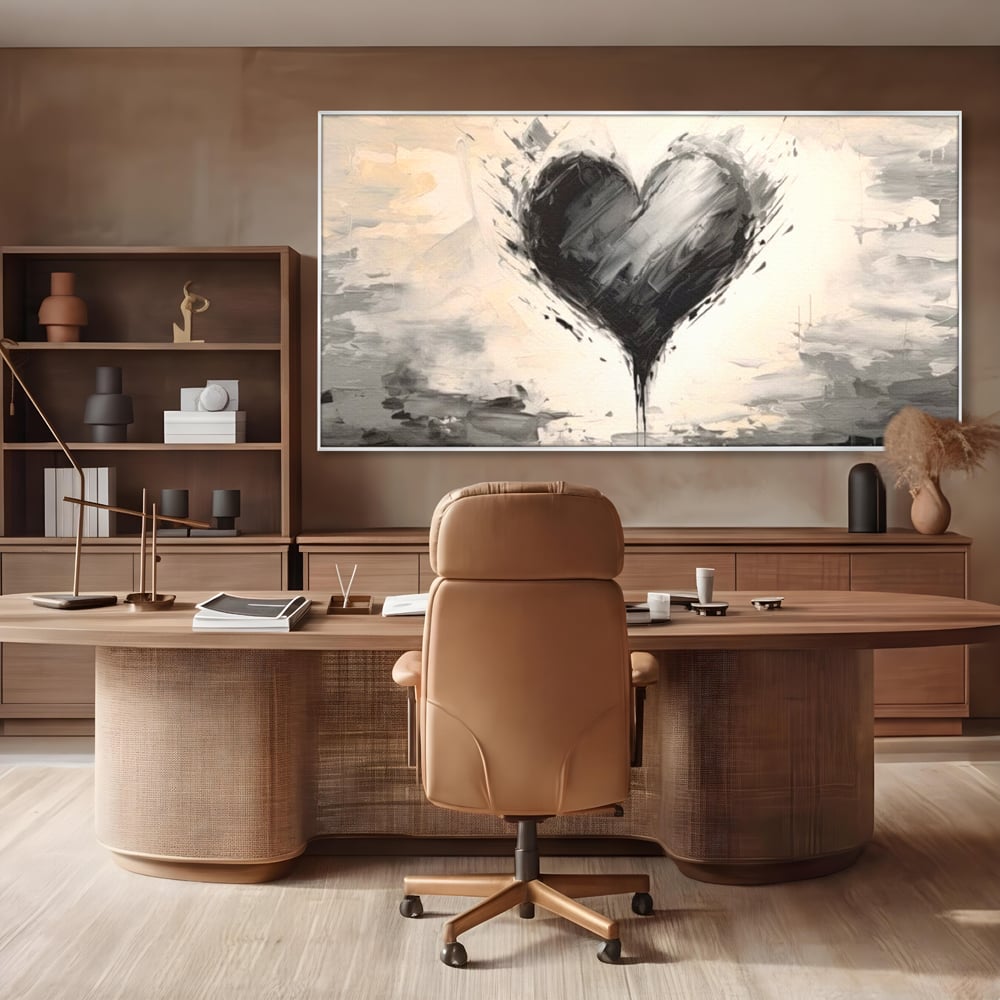 Tablou canvas cu tablou abstract cu inima neagra, in rama de aluminiu argintiu, pe perete intr-un birou